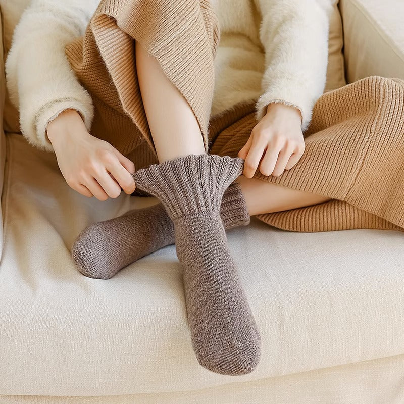 Pulling on a thick slouch sock with a folded ribbed cuff