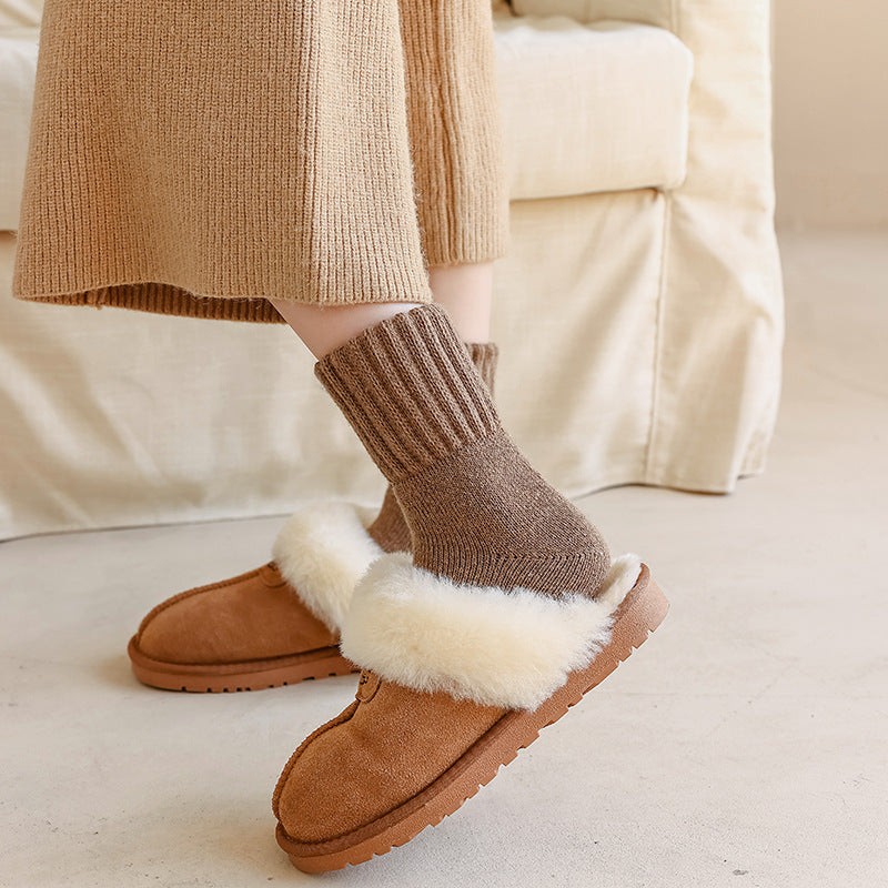 Slouch socks worn with cozy slippers